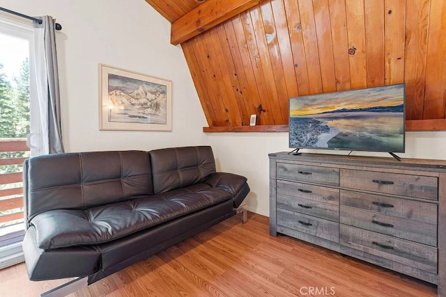 living room featuring wood ceiling, lofted ceiling with beams, and light hardwood / wood-style floors