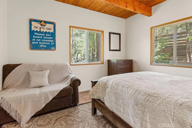 bedroom with beamed ceiling and wooden ceiling