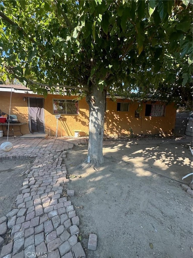 view of front facade with a patio area