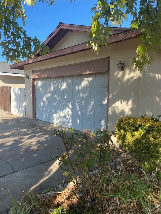 view of side of property with a garage