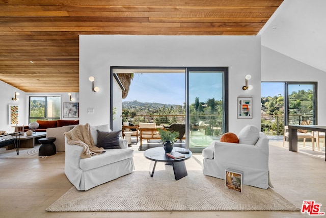 living room with a mountain view, wooden ceiling, and high vaulted ceiling