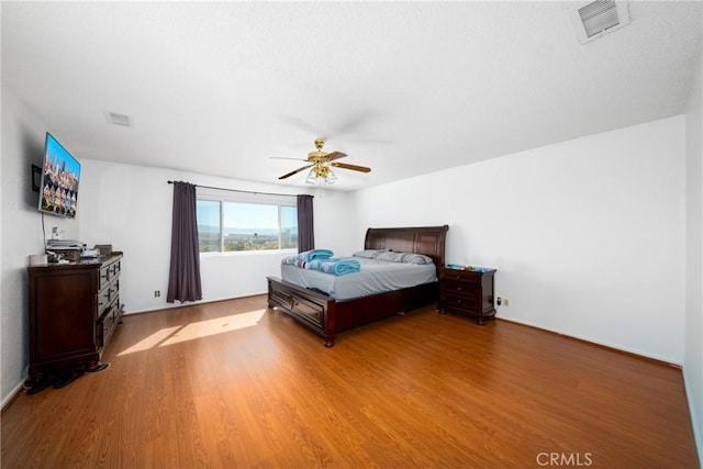 bedroom featuring hardwood / wood-style flooring and ceiling fan