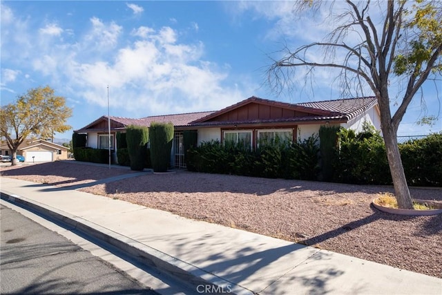 single story home with a garage