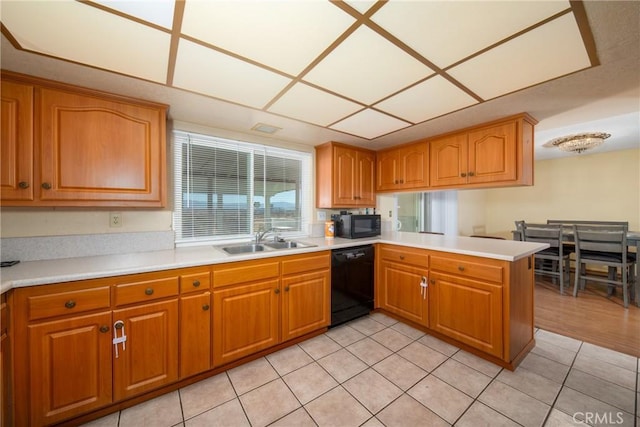 kitchen with black appliances, kitchen peninsula, sink, and light tile patterned floors