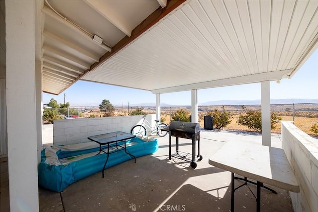 view of patio featuring grilling area and a mountain view