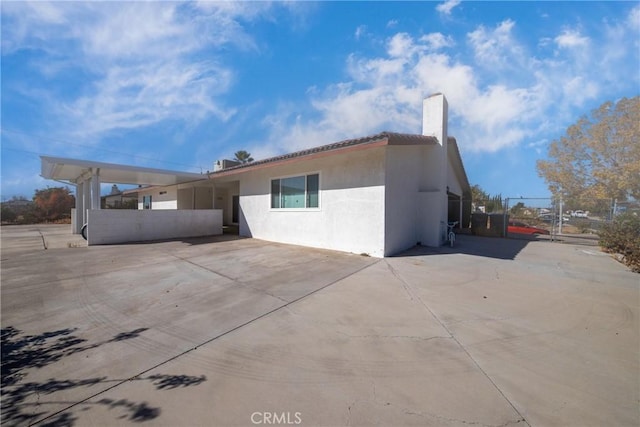 rear view of property featuring a patio