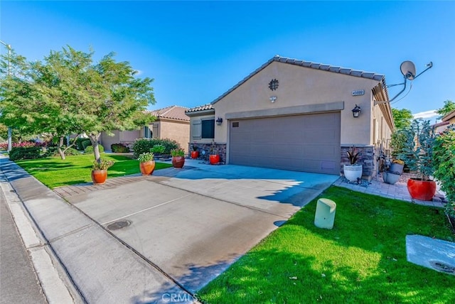 view of front of home featuring a garage and a front lawn