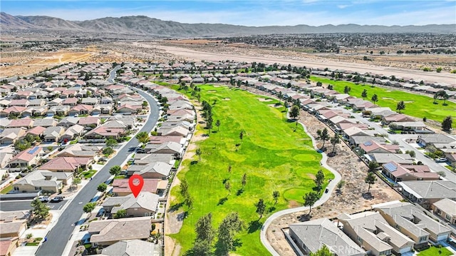 birds eye view of property with a mountain view