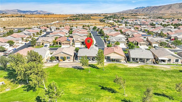 birds eye view of property with a mountain view