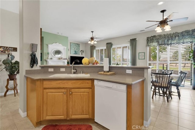 kitchen with ceiling fan, dishwasher, sink, and light tile patterned floors