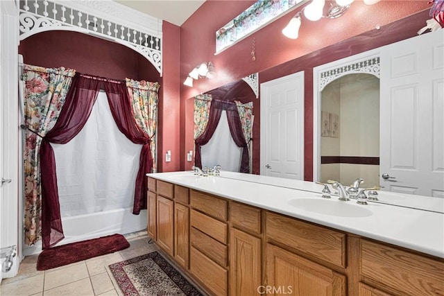 bathroom featuring tile patterned flooring, vanity, and shower / bath combination with curtain