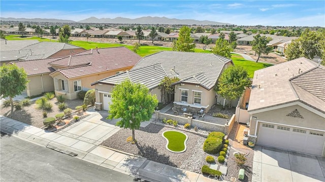 birds eye view of property with a mountain view