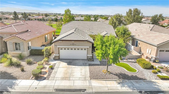 view of front of property featuring a garage and a playground