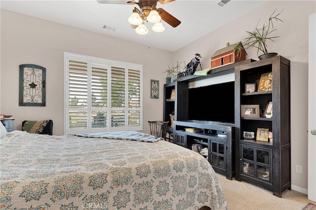 bedroom with light carpet and ceiling fan