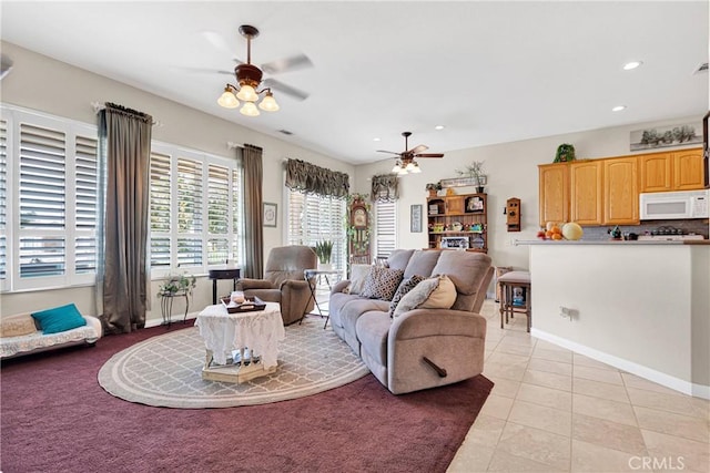 tiled living room with ceiling fan