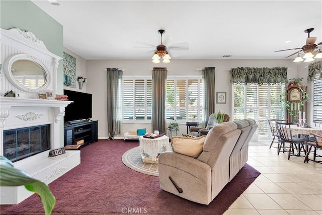 tiled living room with ceiling fan