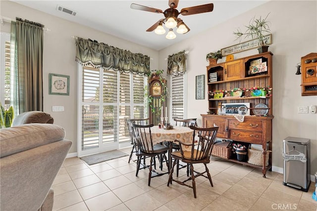 dining area featuring ceiling fan and light tile patterned floors