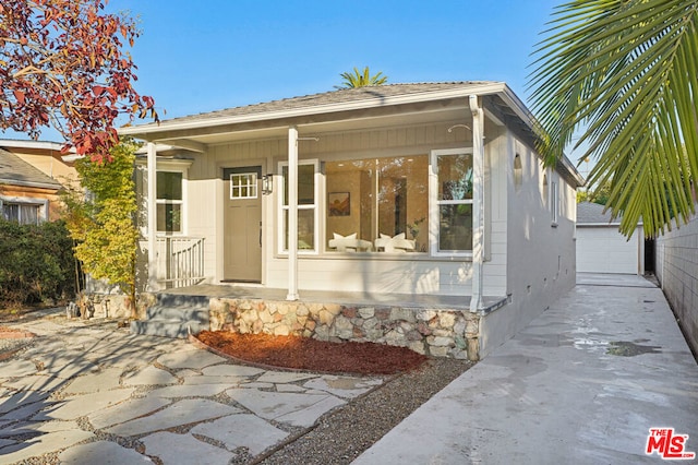 view of front of house with an outbuilding and a garage