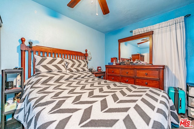 carpeted bedroom with vaulted ceiling and ceiling fan