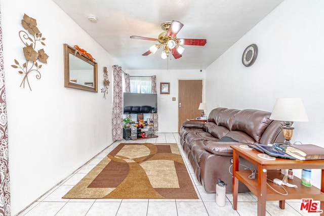 tiled living room featuring ceiling fan