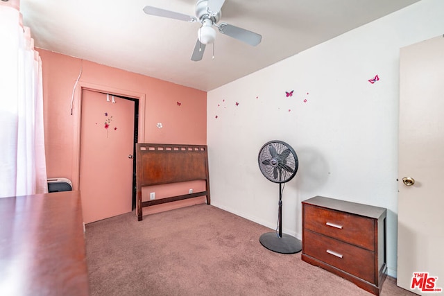 interior space featuring light carpet and ceiling fan