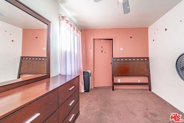 interior space with light colored carpet and ceiling fan