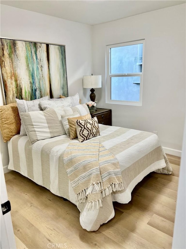 bedroom featuring hardwood / wood-style floors