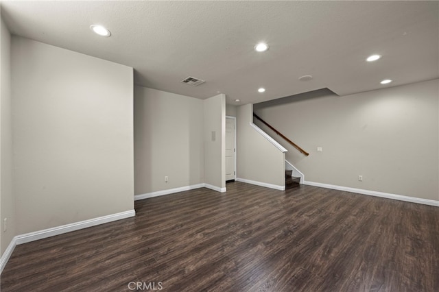 unfurnished living room with dark hardwood / wood-style floors