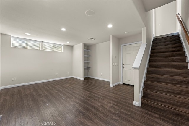 basement with dark wood-type flooring