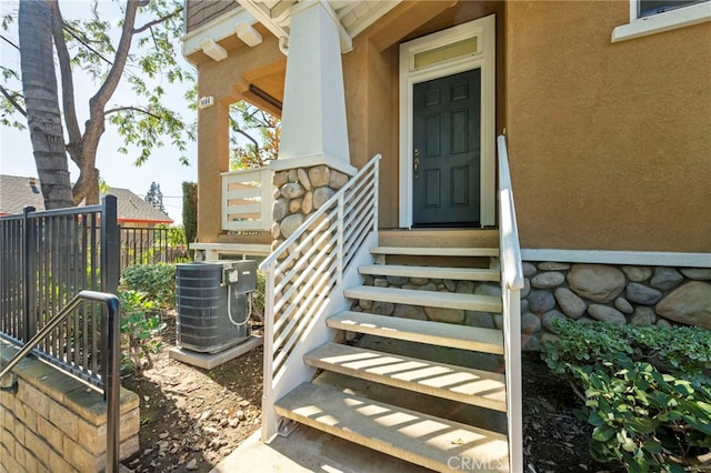 property entrance with central AC unit