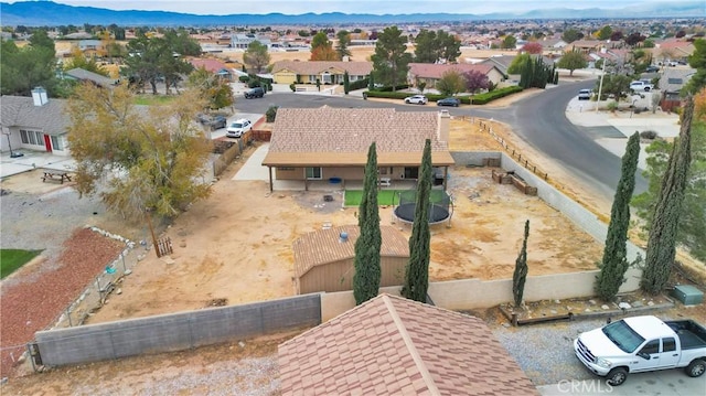 birds eye view of property featuring a mountain view