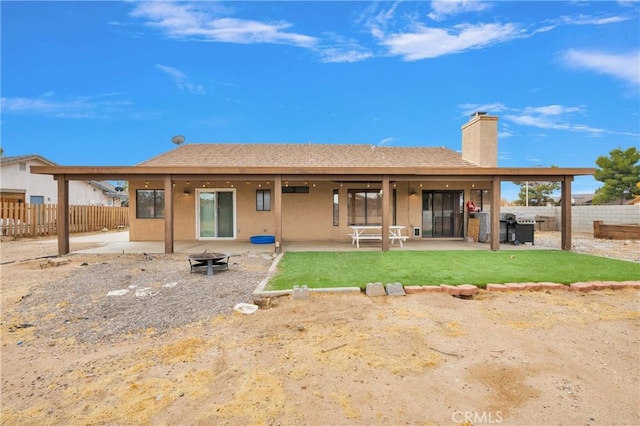 back of house featuring a patio area