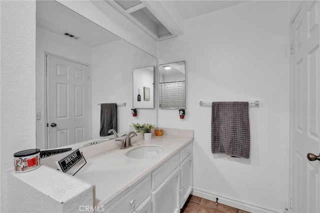 bathroom featuring tile patterned flooring and vanity