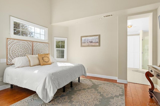 bedroom with hardwood / wood-style floors