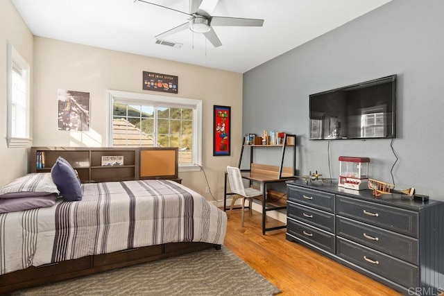 bedroom with hardwood / wood-style flooring and ceiling fan