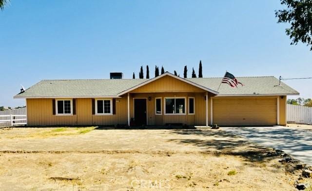 ranch-style house featuring a garage