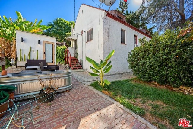 back of property with a patio area