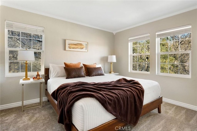 carpeted bedroom with ornamental molding