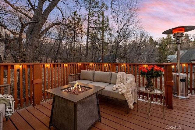 28164 N Bay Rd, Lake Arrowhead, CA 92352 - deck at dusk featuring an outdoor living space with a fire pit