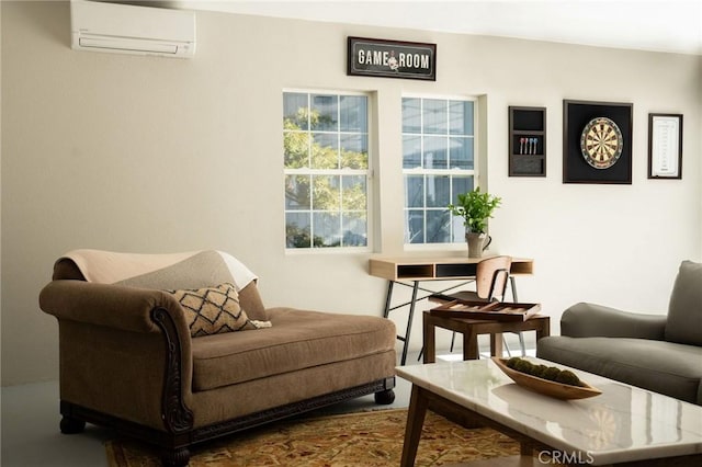 sitting room featuring an AC wall unit