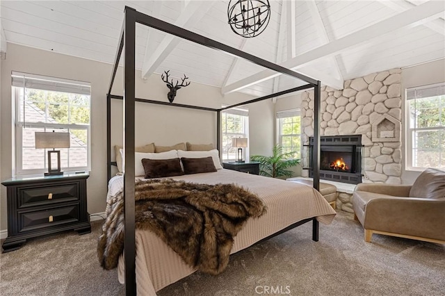 28164 N Bay Rd, Lake Arrowhead, CA 92352 - carpeted bedroom featuring a stone fireplace and a chandelier