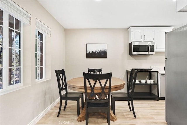 28164 N Bay Rd, Lake Arrowhead, CA 92352 - dining area with light wood-style floors and baseboards