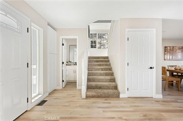 28164 N Bay Rd, Lake Arrowhead, CA 92352 - foyer with light wood-style flooring and stairway