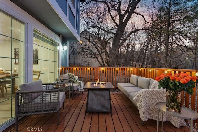 28164 N Bay Rd, Lake Arrowhead, CA 92352 - deck at dusk featuring an outdoor living space with a fire pit