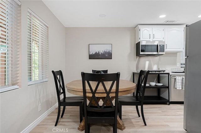 dining room with light wood-type flooring