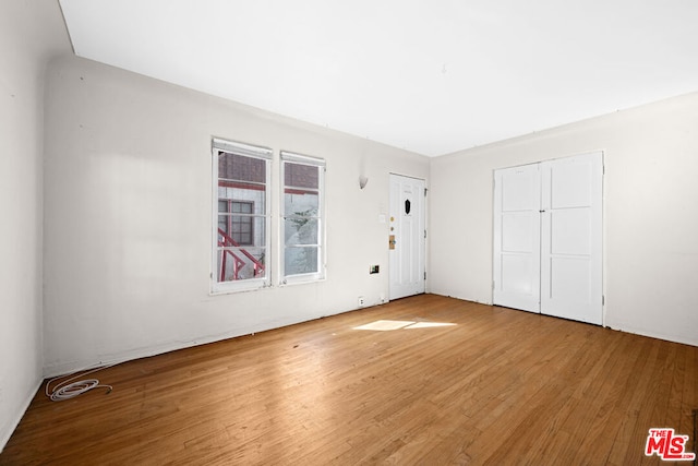 unfurnished bedroom with wood-type flooring