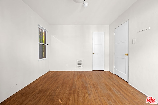 spare room featuring light hardwood / wood-style floors