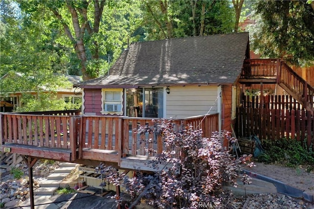 back of property with cooling unit and a wooden deck