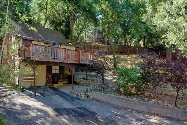 back of property with a wooden deck