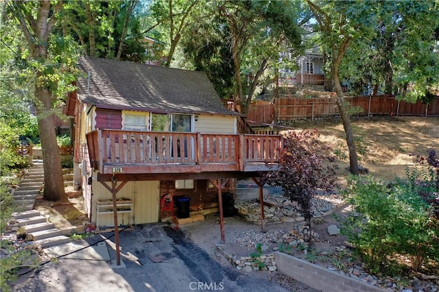 back of property with a wooden deck